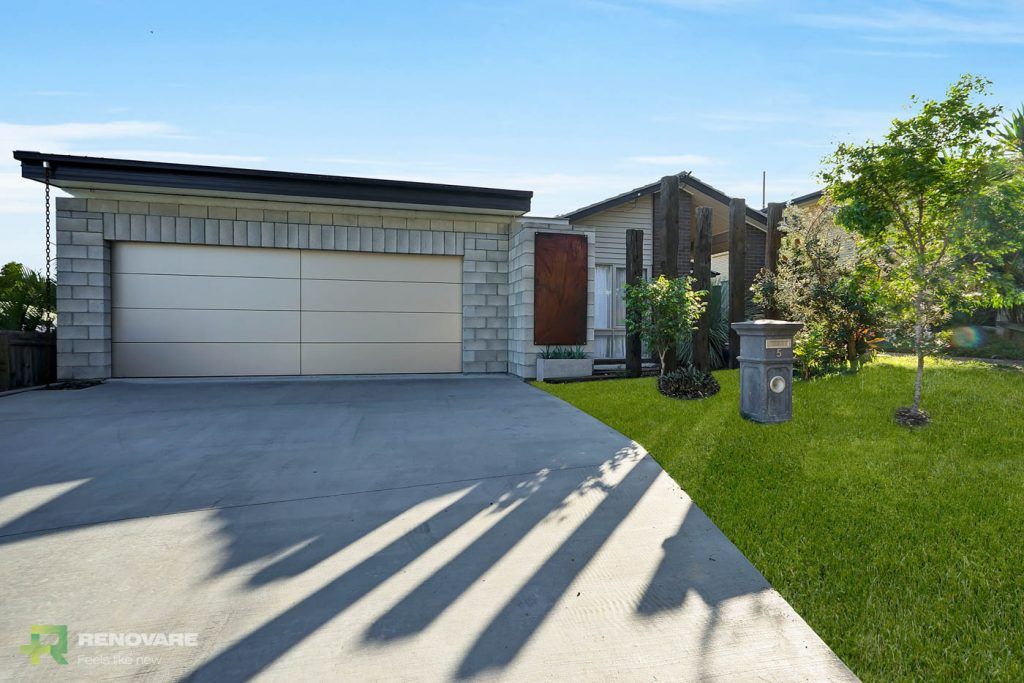 The exterior view of a grey brick house | Featured image on Renovare Mt Gravatt
