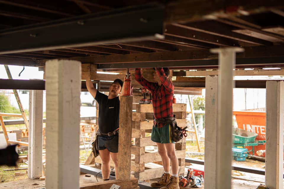 Two Men Working Under Home | Featured Image for Renovare House Lifting And Build Under House